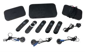 Sky Q box together with two mini room boxes with remotes and a quantity of remote controls and cable