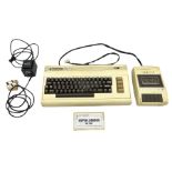 Commodore Vic 20 colour computer with power supply together with Commodore Datassette and Super Land