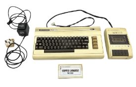 Commodore Vic 20 colour computer with power supply together with Commodore Datassette and Super Land