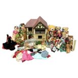 Mock Tudor style two storey dolls house with wood and plastic accessories and furniture