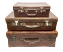 Three vintage leather brown suitcases