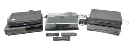 Two VHS video cassette recorders comprising Sharp VC-M312 and Hitachi F645E
