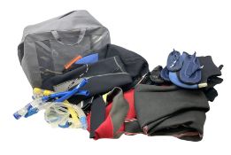 Collection of assorted wetsuits and diving items