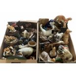 Two boxes of animal figures to include mainly ceramic and composite examples