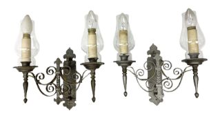 Pair of metal twin wall lights with scrolled branches and glass chimneys