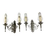 Pair of metal twin wall lights with scrolled branches and glass chimneys