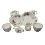 Six Royal Crown Derby teacup trios decorated in the 'Derby Posies' pattern