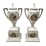 Pair of Sitzendorf twin handled covered urns