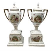 Pair of Sitzendorf twin handled covered urns