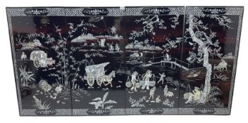 Four Chinese lacquered and mother of pearl inlaid wall panels