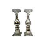 Pair of glass candlesticks with shaped columns decorated with internal silver flaked silver design