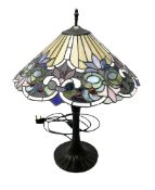 Tiffany style table lamp upon cast spreading foot with leaded glass shade