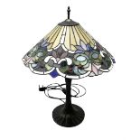 Tiffany style table lamp upon cast spreading foot with leaded glass shade