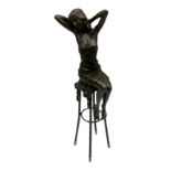 Art Deco style bronze modelled as a female figure seated upon a chair