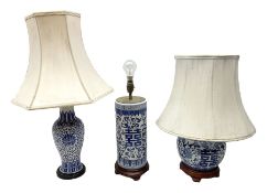 Three oriental table lamps decorated with blue and white floral design