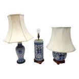 Three oriental table lamps decorated with blue and white floral design