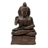 Hand carved wood figure of seated Buddha