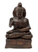 Hand carved wood figure of seated Buddha