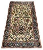 Small Persian Kirman ivory ground rug