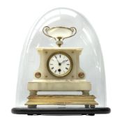 A 19th century French alabaster cased clock in a break front case with a flat top surmounted by an u