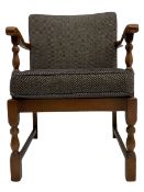 Mid to late 20th century medium oak framed open armchair