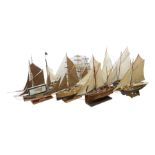 Eight model ships or boats including fishing boat with fish