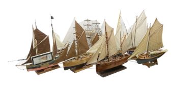 Eight model ships or boats including fishing boat with fish