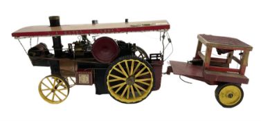 Scratch-built red and yellow painted live-steam scale model of a Showman's Traction Engine