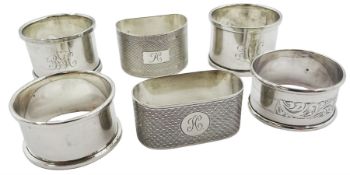 Six silver napkin rings of various form and decoration