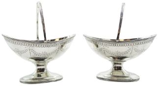 Pair of Victorian silver pedestal table salts