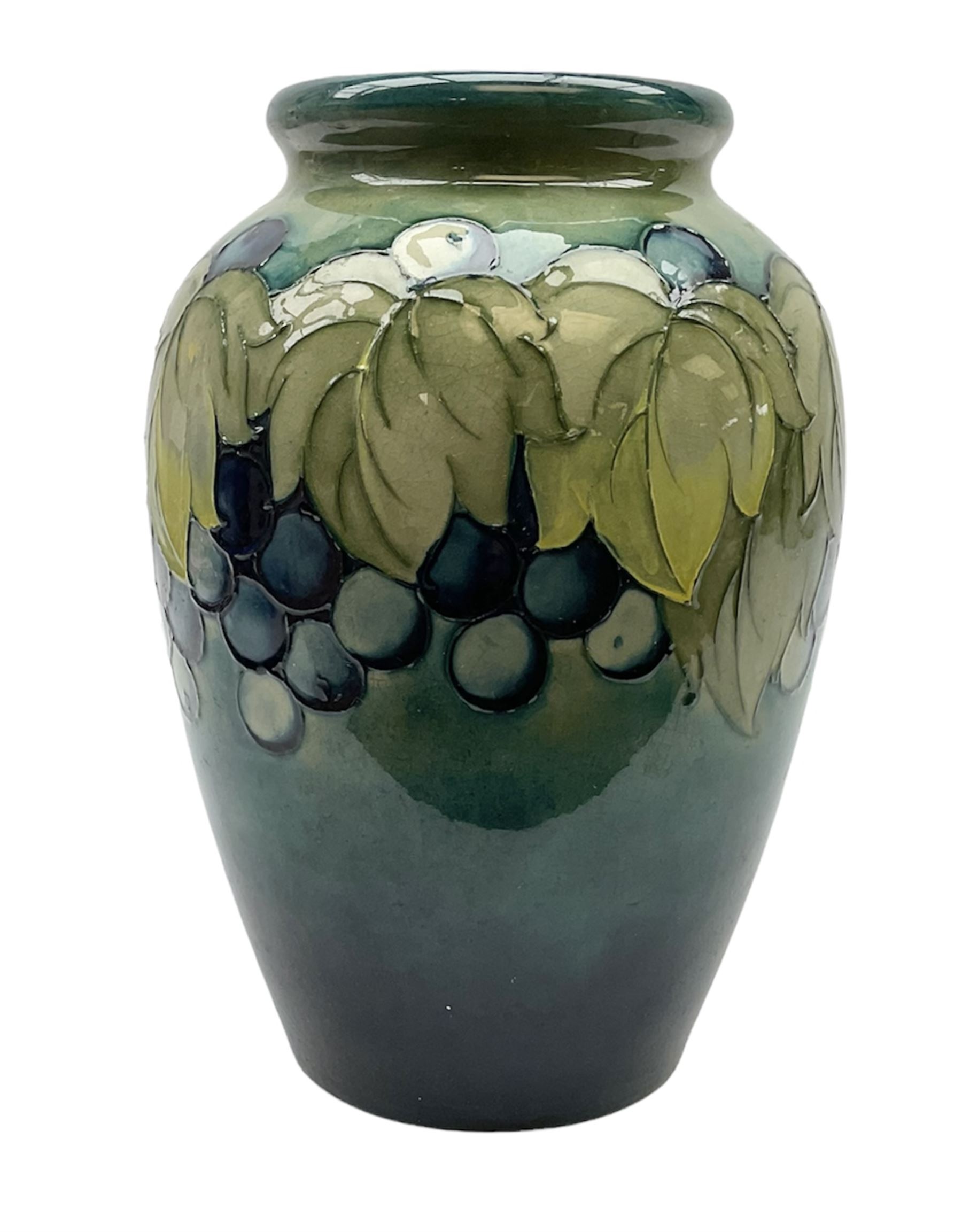 Moorcroft Grape and Leaf pattern baluster vase on green and blue ground