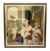 19th century Berlin tapestry depicting interior scene of figures conversing in a oak frame