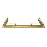 Brass fire curb with spherical finials and tubular rails; internally 122 x 37.5cm