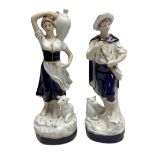 Pair of Royal Dux figures to include Shepherdess carrying a water jug with a recumbent lamb beside h