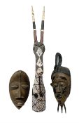 Two carved african spirit masks
