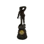 An inspiring early 20th century spelter effect figure of a sailor standing in the bow of a boat scan