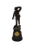 An inspiring early 20th century spelter effect figure of a sailor standing in the bow of a boat scan