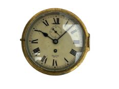 A 20th century English brass cased bulkhead clock with a 6" painted dial