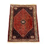 Fine Persian blue and red ground woollen rug