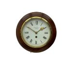 A 20th century wall clock in a mahogany case with a deep wooden bezel