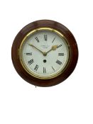 A 20th century wall clock in a mahogany case with a deep wooden bezel