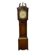 An eight-day longcase clock in an oak and mahogany case