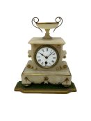 A 19th century French mantle clock in an alabaster case with an 8-day Parisian timepiece movement