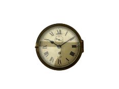 A 20th century English brass cased bulkhead clock with a 6" dial