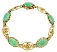 Gold oval jade and flower link bracelet