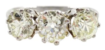 Platinum three stone old cut diamond ring