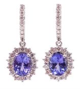 Pair of 14ct white gold oval tanzanite and round brilliant cut diamond cluster