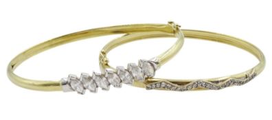 Two 9ct gold cubic zirconia bangles