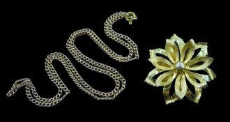 Gold flower design openwork brooch and a gold link necklace