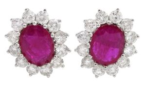 Pair of 18ct white gold oval ruby and round brilliant cut diamond stud earrings